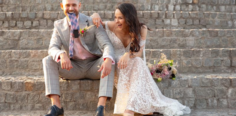 Caucasian romantic young couple celebrating their marriage in city